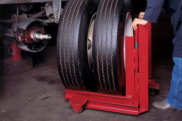 Someone putting tires onto a bearing